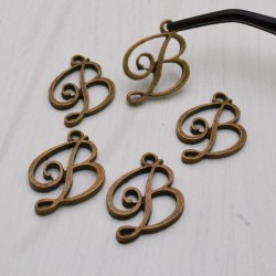5 pz ciondoli forma B in metallo 15 x 22  PER BIGIOTTERIA