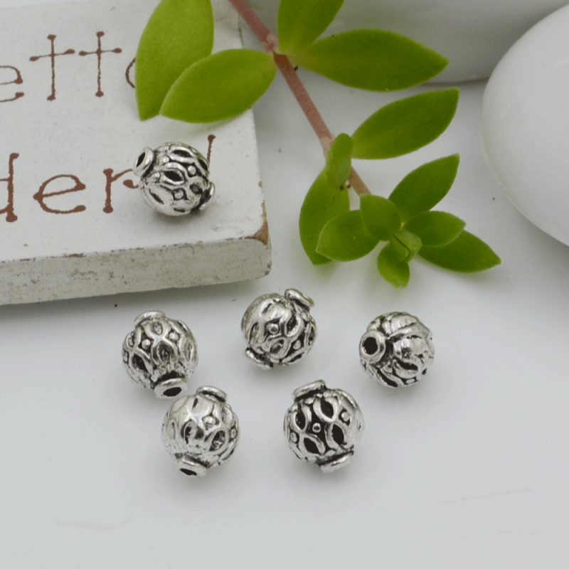 Distanziatori Perline con fantasia 6.6 x 6 mm 12 pz in metallo per bigiotteria per le tue creazioni!