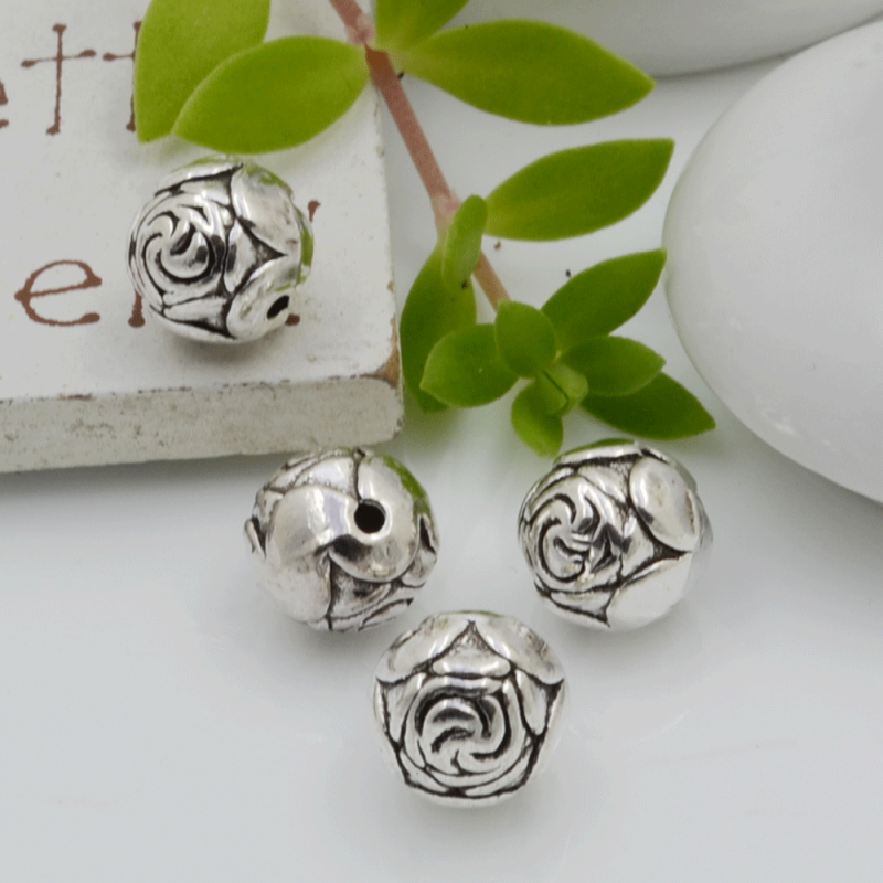 Distanziatori Perline tondo con fantasia a fiori 9 mm 4 pz in metallo per bigiotteria per le tue creazioni!
