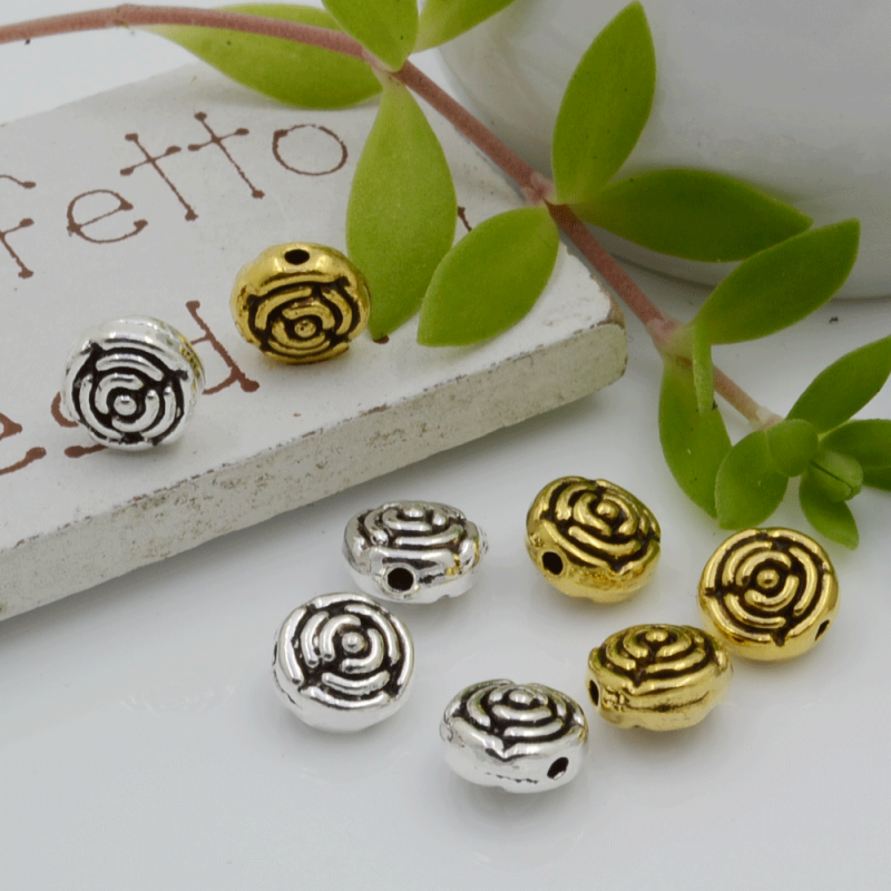Distanziatori Perline con fantasia a fiore 7 x 5 mm 10 pz in metallo per bigiotteria per le tue creazioni!