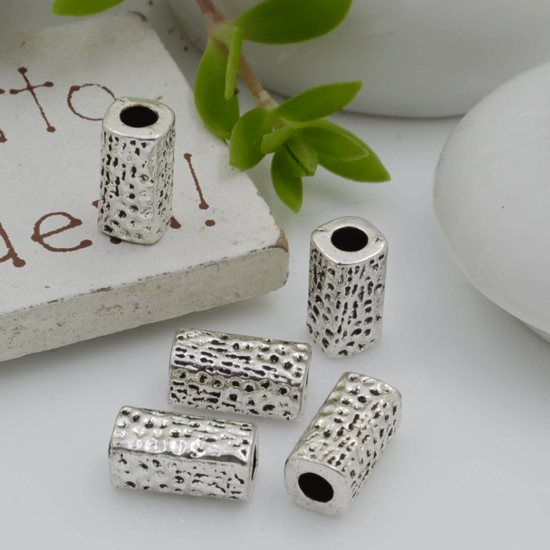 Distanziatori Perline con fantasia a forma di cilindro 10 x 5 mm 6 pz in metallo per bigiotteria per le tue creazioni!
