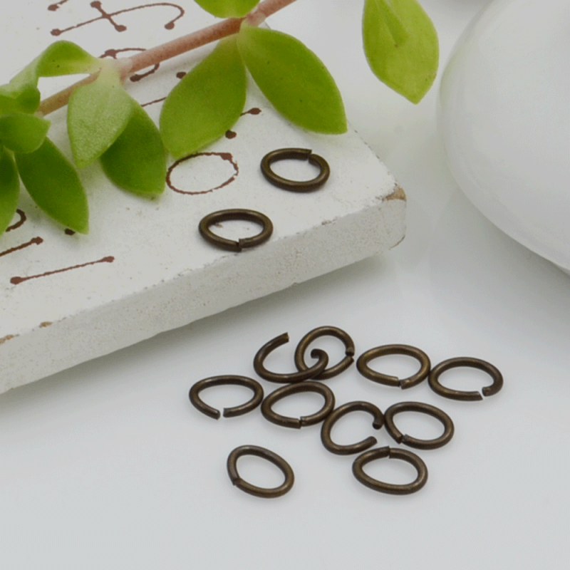  Anellini ovale aperti in ottone filo 0.6 mm dimensione 4 x 5 mm 60 pz fai da te  