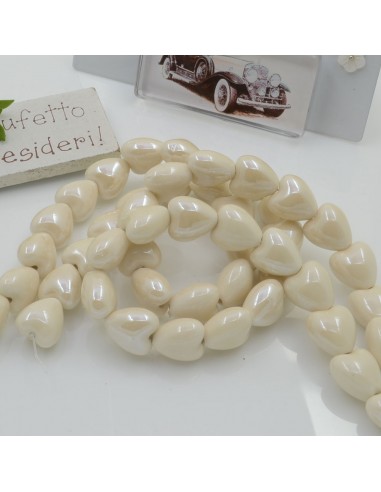 Perle cuore in ceramica colore panna 12x13mm 1 filo 25pz GDO