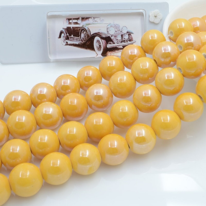Filo di perle rotonde in ceramica smaltata 16-18 mm 22pz Gioie d'Oriente