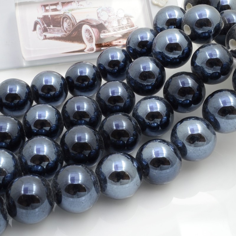 Filo di perle rotonde in ceramica smaltata 16-18 mm 22pz Gioie d'Oriente