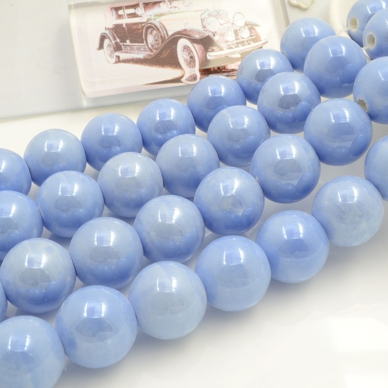 Filo di perle rotonde in ceramica smaltata 16-18 mm 22pz Gioie d'Oriente