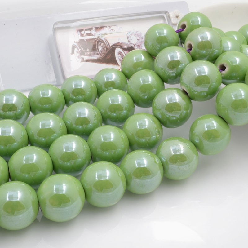 Filo di perle rotonde in ceramica smaltata 16-18 mm 22pz Gioie d'Oriente
