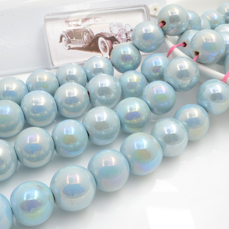 Filo di perle rotonde in ceramica smaltata 16-18 mm 22pz Gioie d'Oriente
