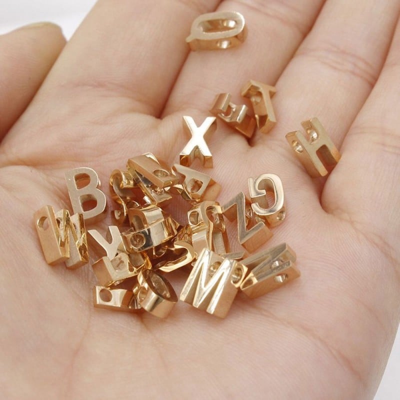 Distanziatore lettera alfabeto in acciaio oro rosa 8mm 1pz Gioie d'Oriente