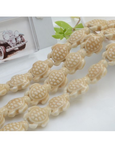 Filo perle a forma di tartaruga bombata in ceramica luminosa e smaltata colore beige 19 x 15 mm 20 pz cod 005