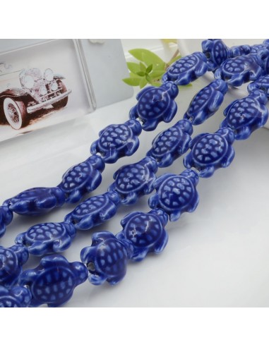 Filo perle a forma di tartaruga bombata in ceramica luminosa e smaltata colore blu chiaro 19 x 15 mm 20 pz cod 009