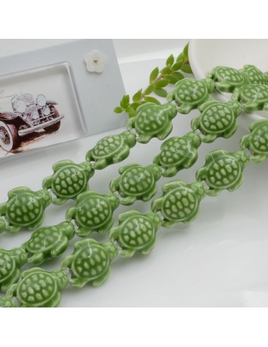 Filo perle a forma di tartaruga bombata in ceramica luminosa e smaltata colore verde 19 x 15 mm 20 pz cod 013