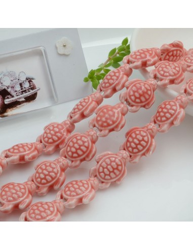 Filo perle a forma di tartaruga bombata in ceramica luminosa e smaltata colore salmone 19 x 15 mm 20 pz cod 034