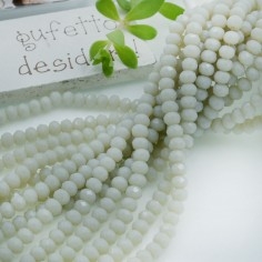 Filo rondelle briolette in mezzi cristalli grigio cenere 3 x 4 mm 125-145pz Gioie d'Oriente