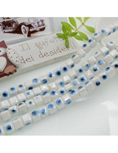 Filo perle a cubo con occhio greco in ceramica colore bianco 7mm 55pz GDO