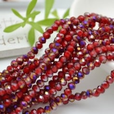 Filo rondelle briolette in mezzi cristalli rosso ametista 3 x 4 mm 120pz Gioie d'Oriente