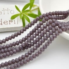 Filo rondelle briolette in mezzi cristalli lilla scuro 3 x 4 mm 100pz Gioie d'Oriente