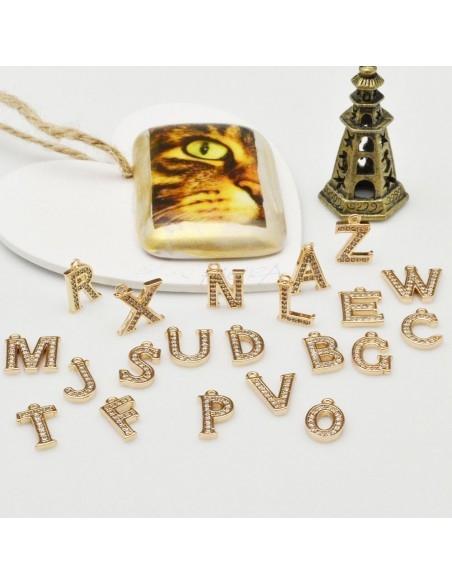 Ciondolo lettera in rame oro con zircone 7x11mm 1pz Gioie d'Oriente