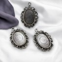 Base per Cabochon ovale in metallo argento interno 12x17mm - esterno 21x29mm 3pz | GDO