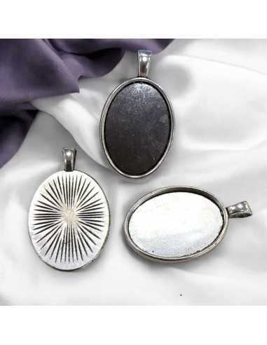 Base per Cabochon ovale in metallo argento interno 18x25mm - esterno 20x35mm 2pz | GDO