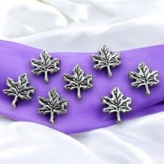 Ciondoli foglie cinque punte argento in metallo 13x27mm 7pz Gioie d'Oriente