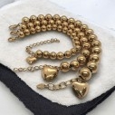 Bracciale sfere oro 8-12mm con cuore sonaglio pendente | GDO