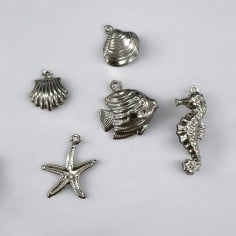 Ciondoli marini 3D in acciaio inox argento forme assortite 2pz Gioie d'Oriente