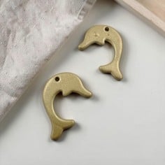 Ciondolo a forma di Delfino in Zama oro opaco 15x20mm 2pz | Gioie d'Oriente