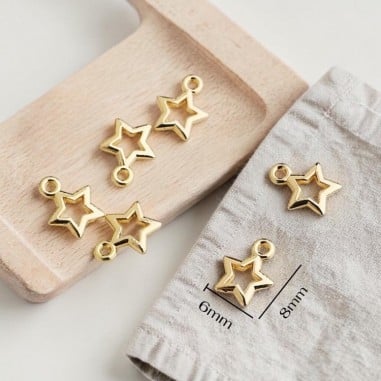 Ciondoli stella vuota in ottone oro 6x8 e 10x12 mm 2pz Gioie d'Oriente