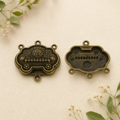 Ciondoli centrali con 4 fori in metallo bronzo 34x31 mm 2pz Gioie d'Oriente